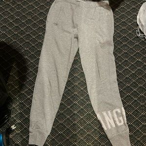 Victoria’s Secret size xsmall grey lounge pants cuffed at the bottom.
